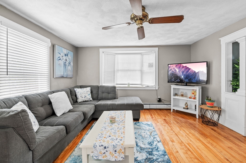 42 Chase Street Danvers, MA 01923 - Photo 6 of 37 a living room with furniture and a flat screen tv