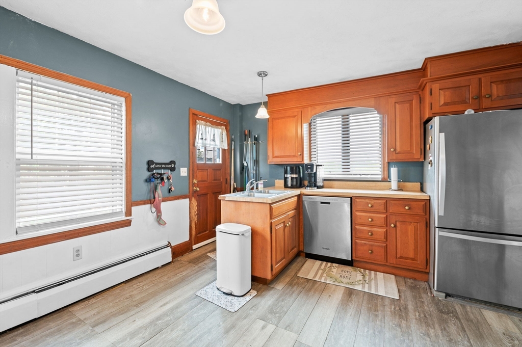 42 Chase Street Danvers, MA 01923 - Photo 9 of 37 a kitchen with sink cabinets and wooden floor