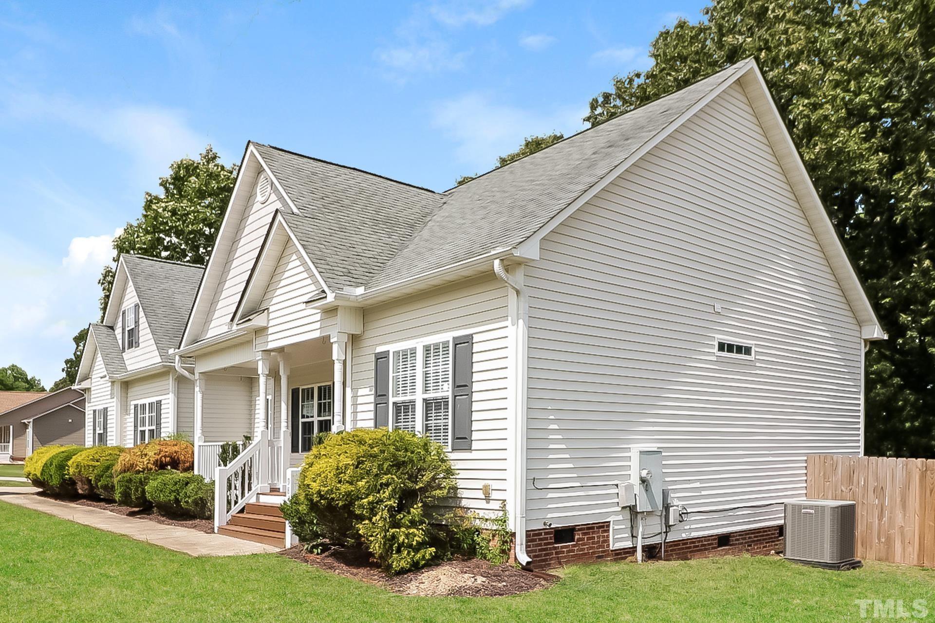 98 Moonlight Drive Garner, NC 27529 - Photo 4 of 17 a view of backyard with a garden and plants
