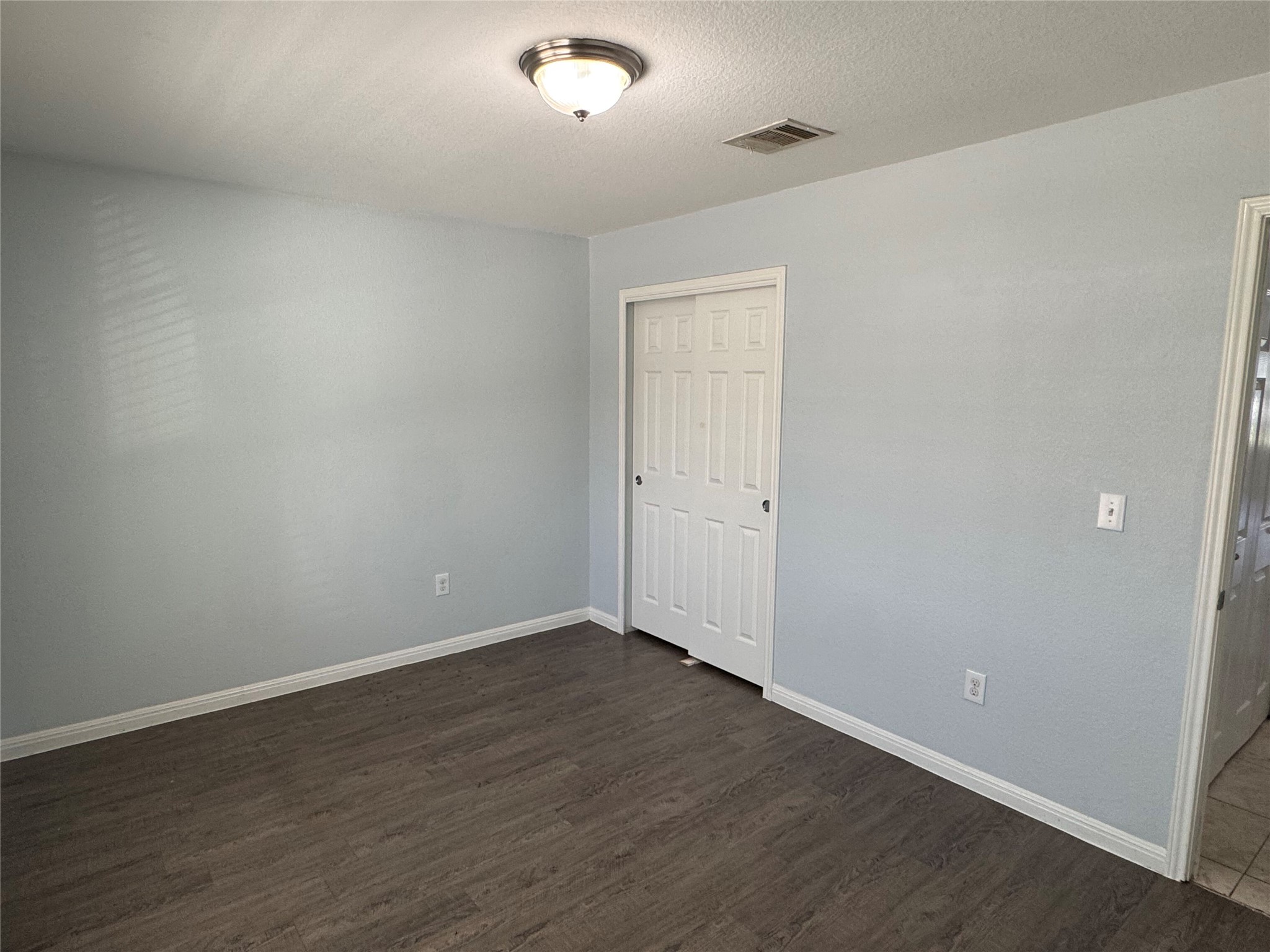 1520 Portchester Castle Path Pflugerville, TX 78660 - Photo 10 of 26 Laminate flooring extends through this tranquil sleeping chamber, complemented by a convenient closet.