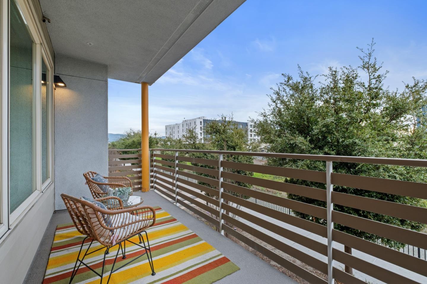 330 Riesling Avenue, Unit 23 Milpitas, CA 95035 - Photo 13 of 51 a balcony with wooden floor and city view