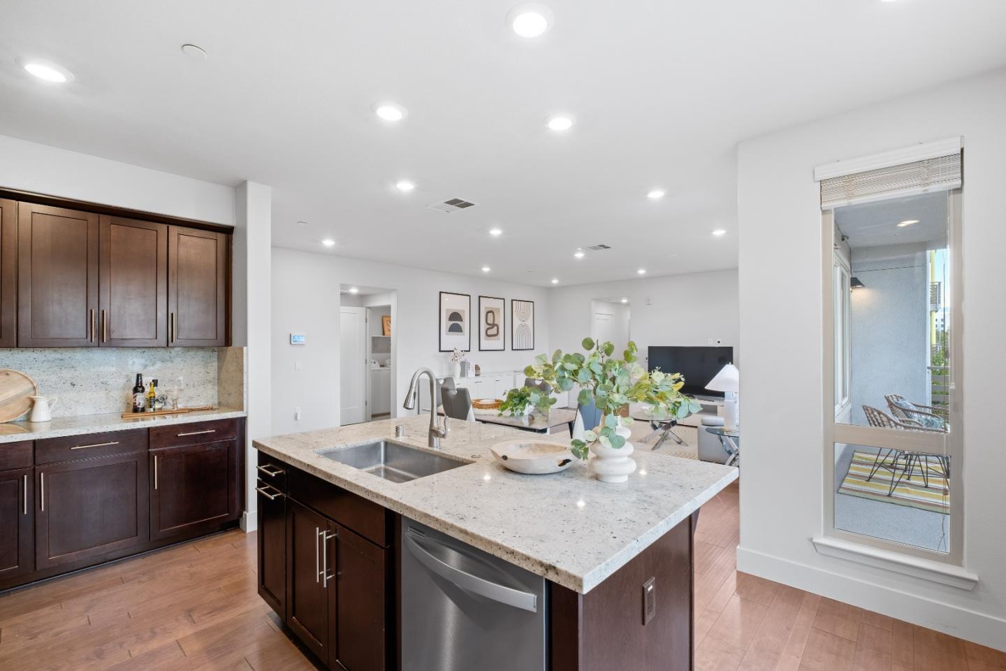 330 Riesling Avenue, Unit 23 Milpitas, CA 95035 - Photo 17 of 51 a kitchen with stainless steel appliances kitchen island granite countertop a sink and cabinets