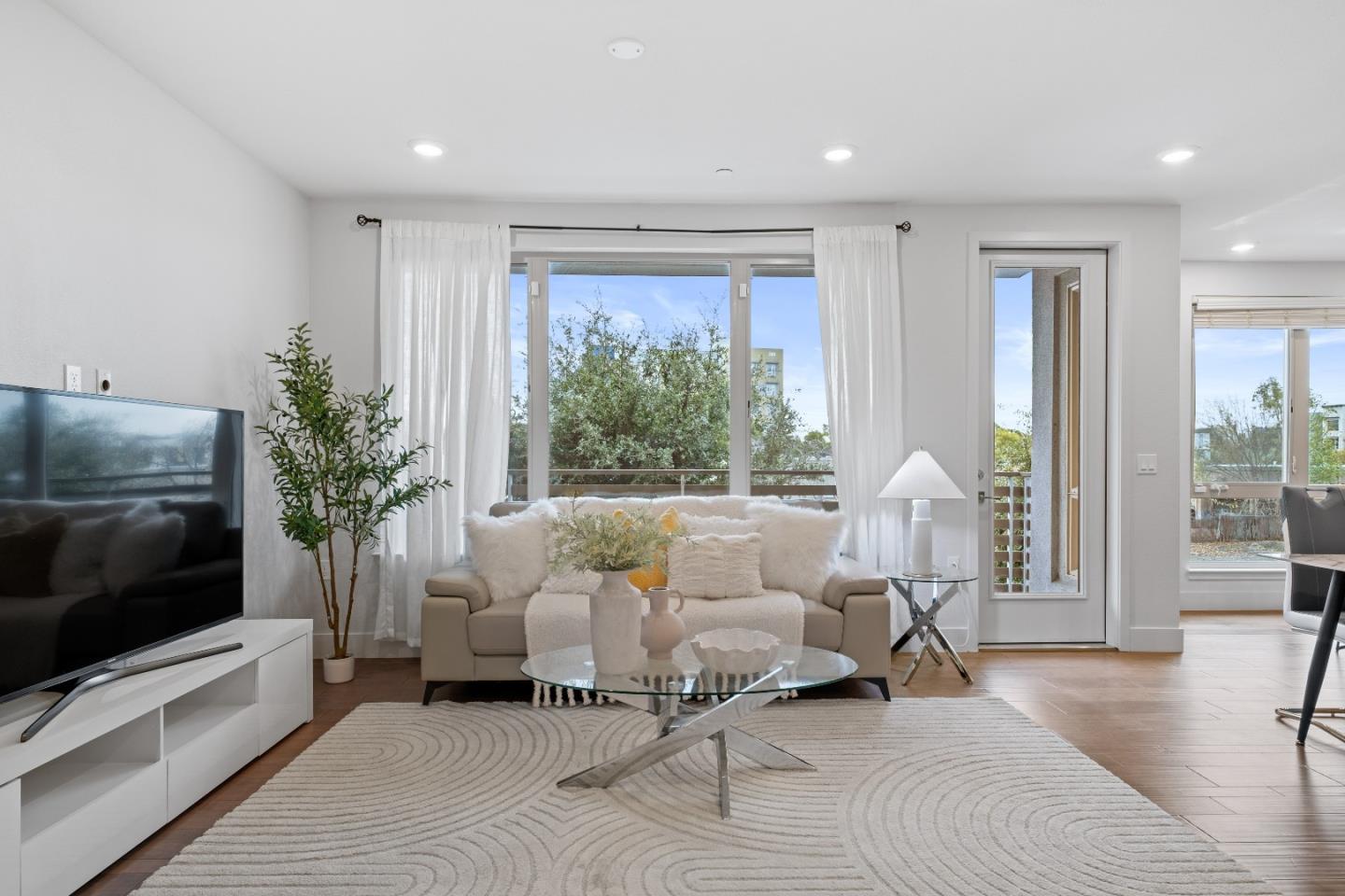 330 Riesling Avenue, Unit 23 Milpitas, CA 95035 - Photo 2 of 51 a living room with furniture and a flat screen tv