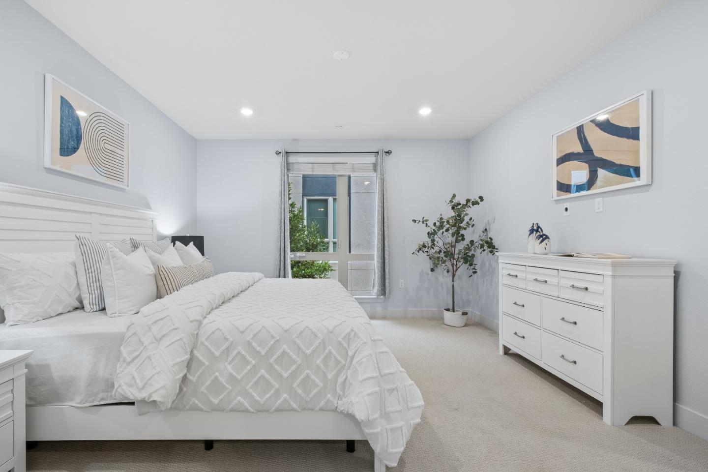 330 Riesling Avenue, Unit 23 Milpitas, CA 95035 - Photo 24 of 51 a bedroom with a bed and a dresser