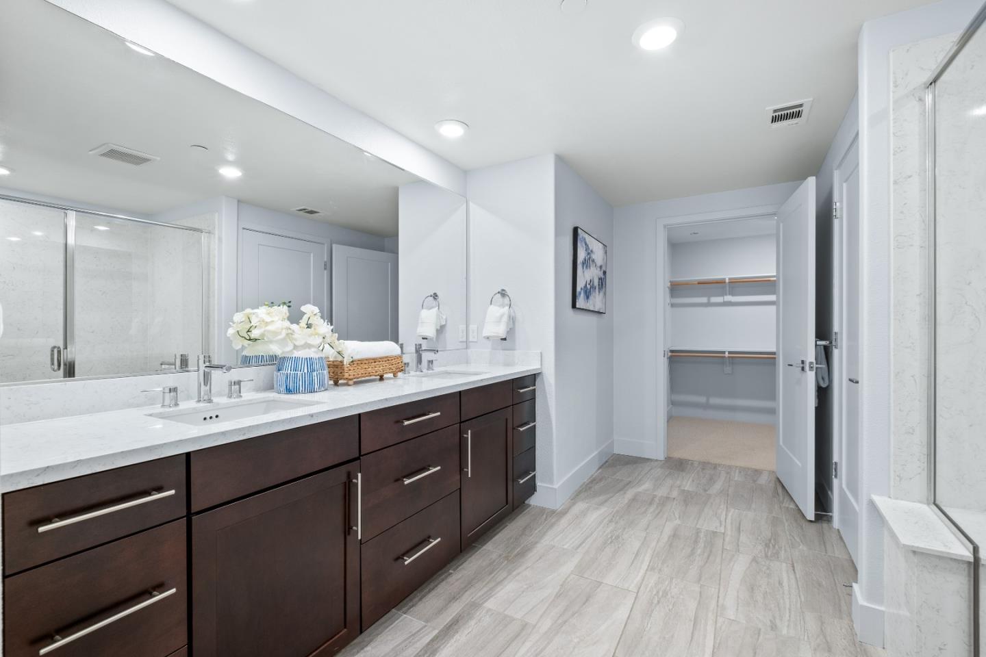 330 Riesling Avenue, Unit 23 Milpitas, CA 95035 - Photo 27 of 51 a spacious bathroom with a double vanity sink double and mirror