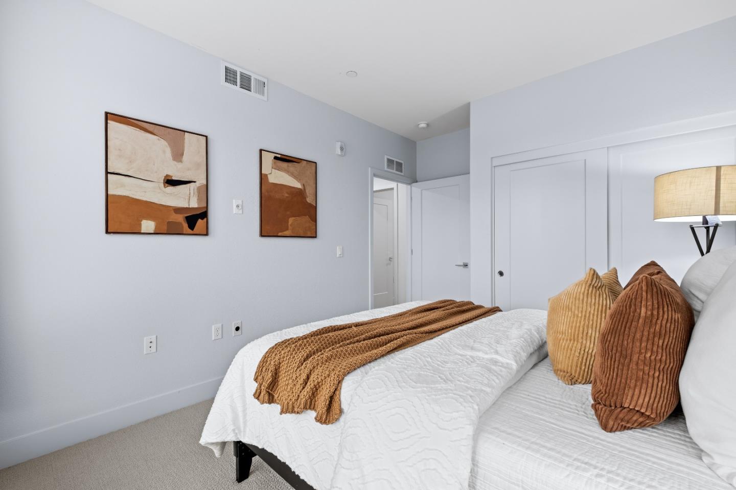330 Riesling Avenue, Unit 23 Milpitas, CA 95035 - Photo 35 of 51 a bedroom with a bed and painting on the wall