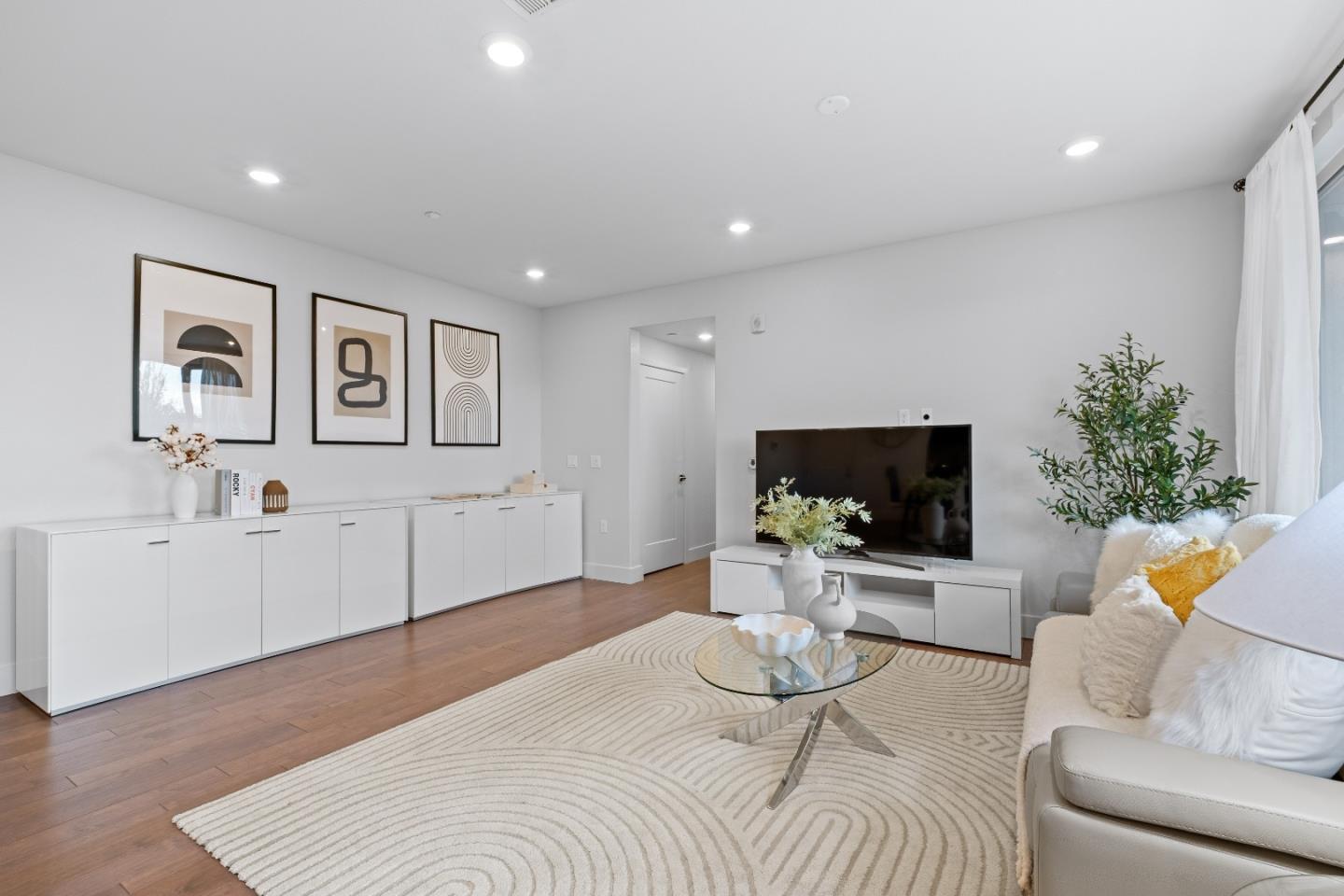 330 Riesling Avenue, Unit 23 Milpitas, CA 95035 - Photo 5 of 51 a living room with furniture and a flat screen tv