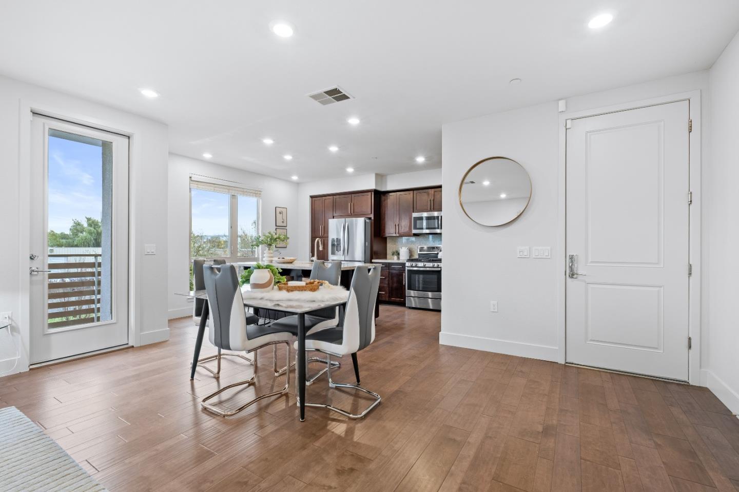 330 Riesling Avenue, Unit 23 Milpitas, CA 95035 - Photo 7 of 51 a living room with furniture and wooden floor