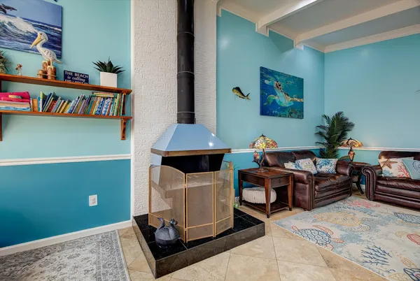 a living room with furniture and a book shelf
