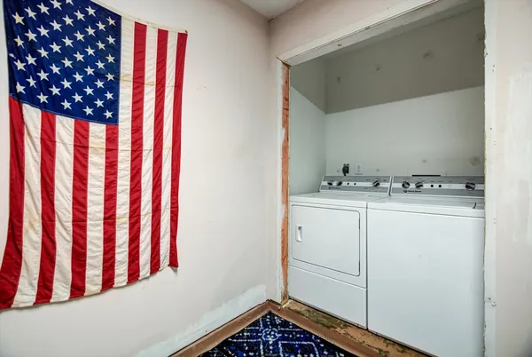 a view of a room with washer and dryer