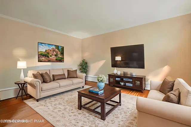 view of living room with furniture and a fireplace