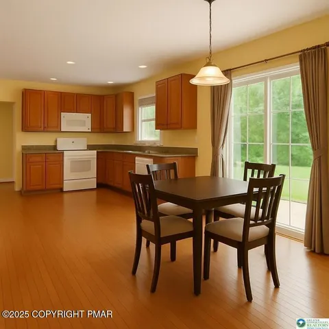 a view of a workspace with furniture and a bookshelf