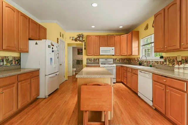 a bed room with a bed and a chair