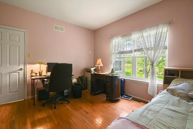 a balcony with furniture and a potted plant
