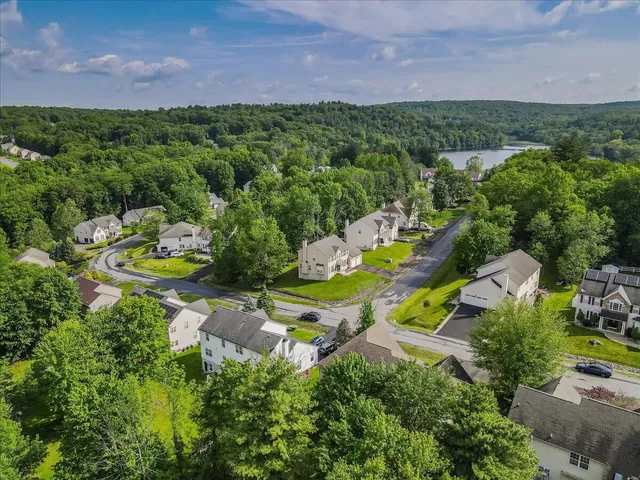 a kitchen with stainless steel appliances granite countertop a stove a sink dishwasher and a refrigerator