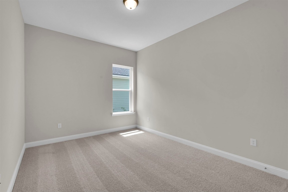 323 Sawgrass Drive Yulee, FL 32097 - Photo 11 of 33 a view of an empty room with a window