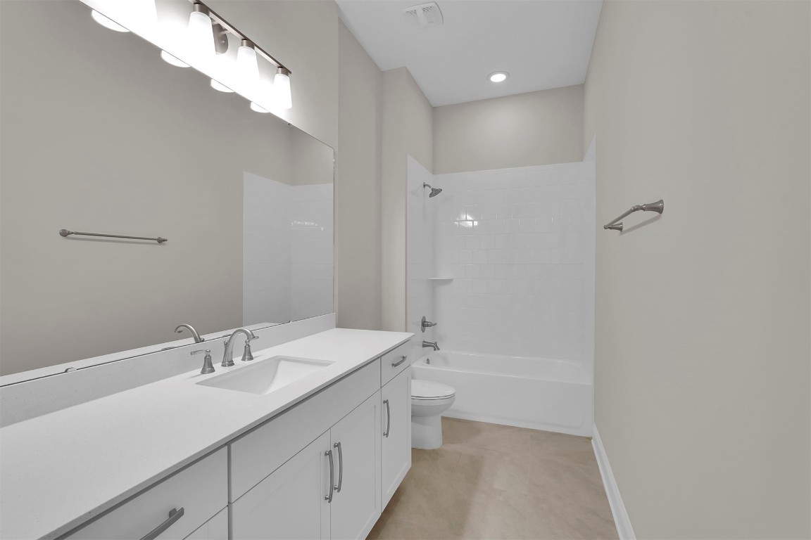 323 Sawgrass Drive Yulee, FL 32097 - Photo 13 of 33 a bathroom with a sink a toilet and shower