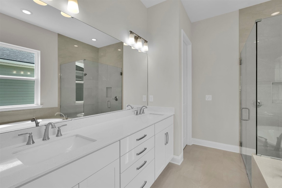 323 Sawgrass Drive Yulee, FL 32097 - Photo 25 of 33 a spacious bathroom with double sink and a mirror