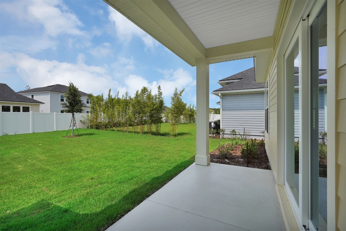 323 Sawgrass Drive Yulee, FL 32097 - Photo 28 of 33 a view of house with backyard and garden