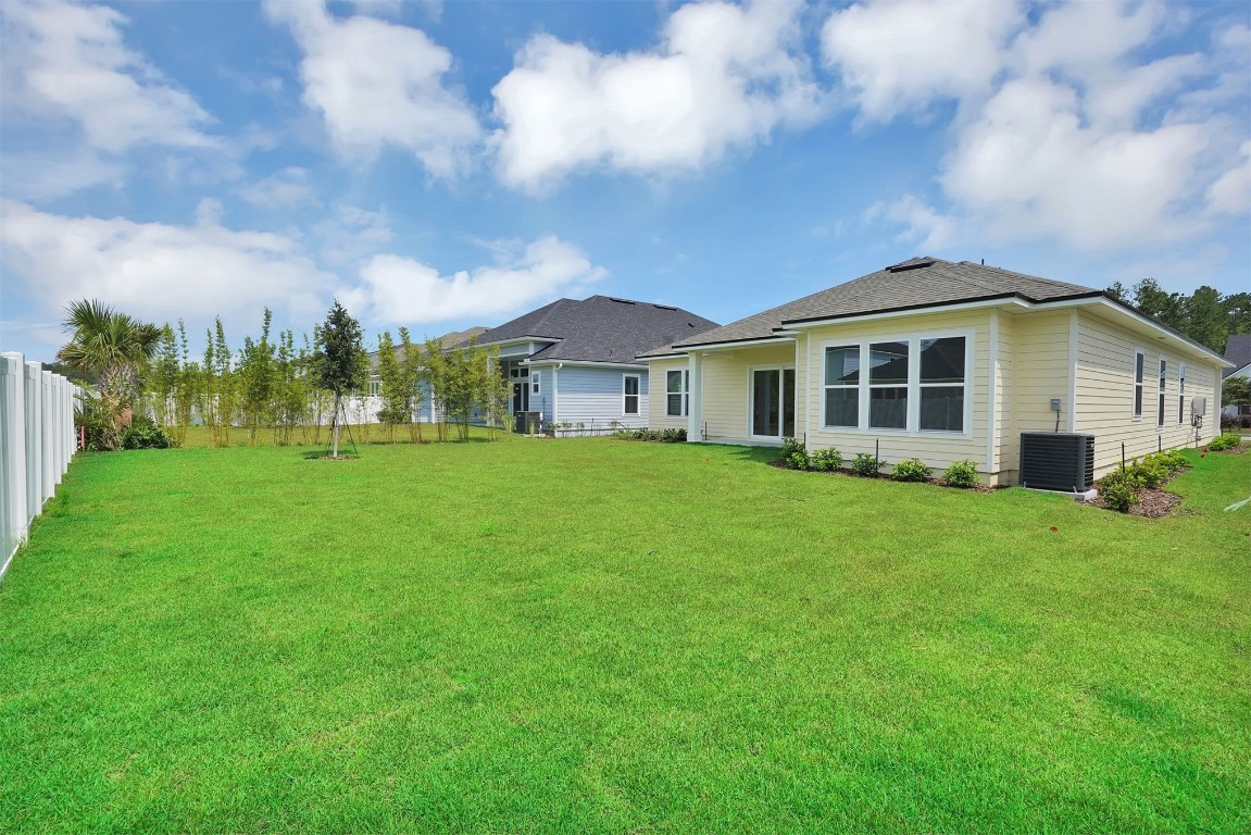 323 Sawgrass Drive Yulee, FL 32097 - Photo 32 of 33 a view of a house with yard and green space