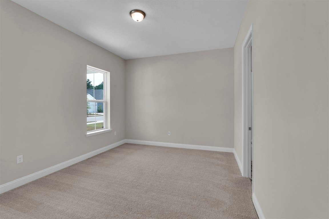 323 Sawgrass Drive Yulee, FL 32097 - Photo 7 of 33 an empty room with windows and closet