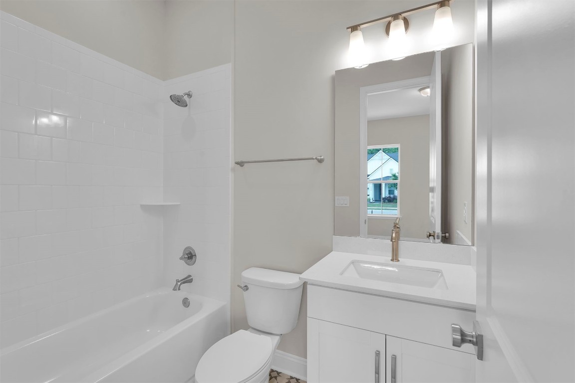 323 Sawgrass Drive Yulee, FL 32097 - Photo 9 of 33 a bathroom with a sink toilet and shower