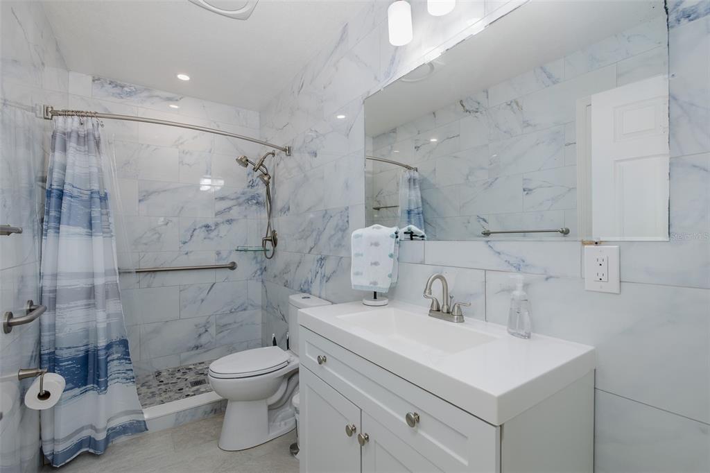 14616 Blessing Lane Hudson, FL 34667 - Photo 15 of 29 a bathroom with a sink toilet and shower