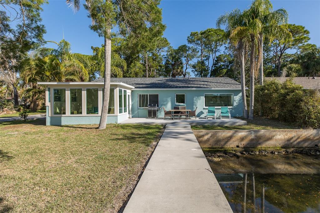 14616 Blessing Lane Hudson, FL 34667 - Photo 18 of 29 front view of a house with a patio