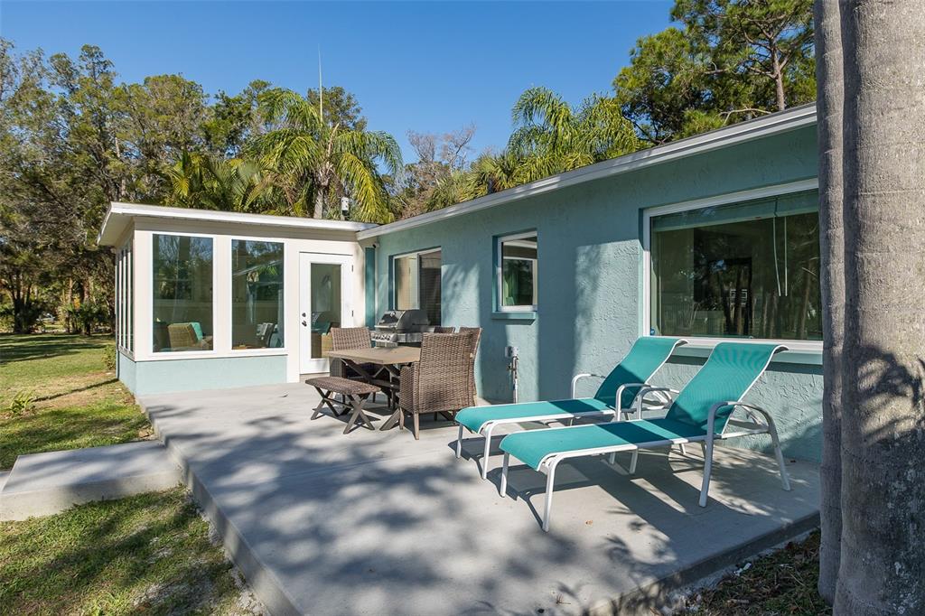 14616 Blessing Lane Hudson, FL 34667 - Photo 19 of 29 a view of backyard with outdoor seating and green space