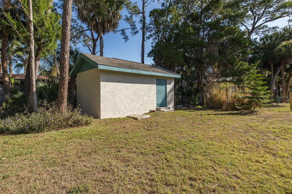 14616 Blessing Lane Hudson, FL 34667 - Photo 23 of 29 a house with trees in front of it