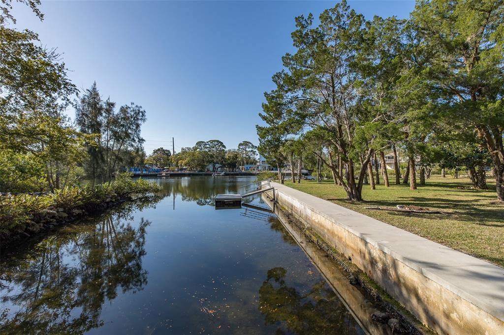 14616 Blessing Lane Hudson, FL 34667 - Photo 27 of 29 a view of a lake with trees and houses