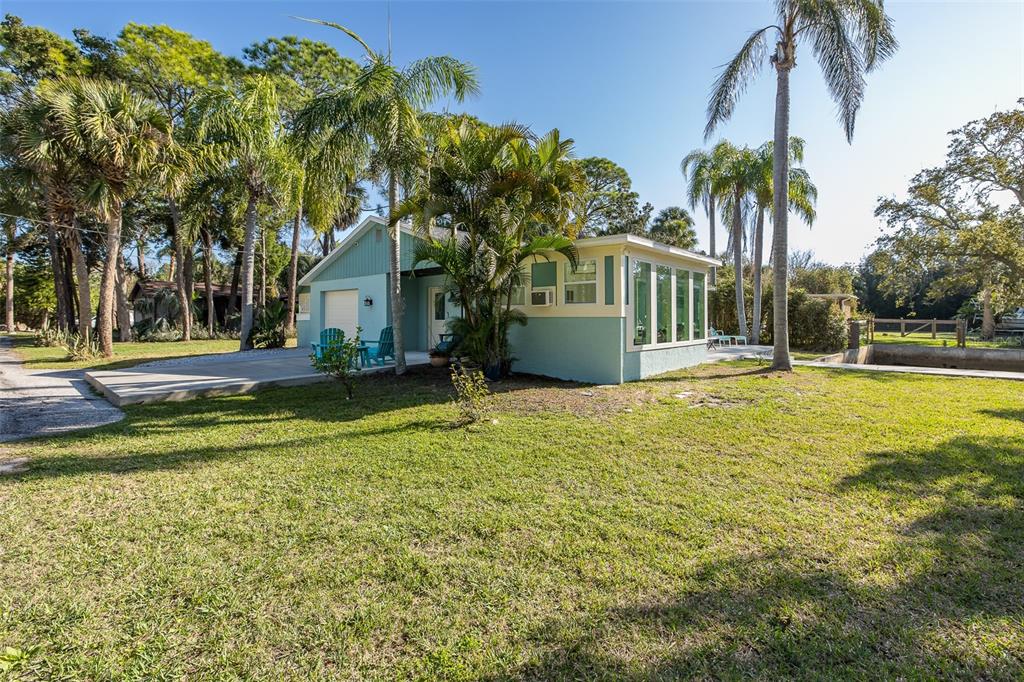 14616 Blessing Lane Hudson, FL 34667 - Photo 4 of 29 a front view of house with yard and green space
