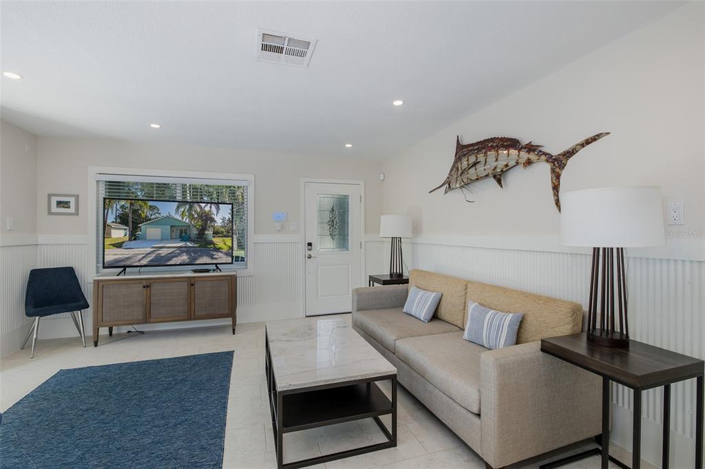 14616 Blessing Lane Hudson, FL 34667 - Photo 6 of 29 a living room with furniture and a wooden floor