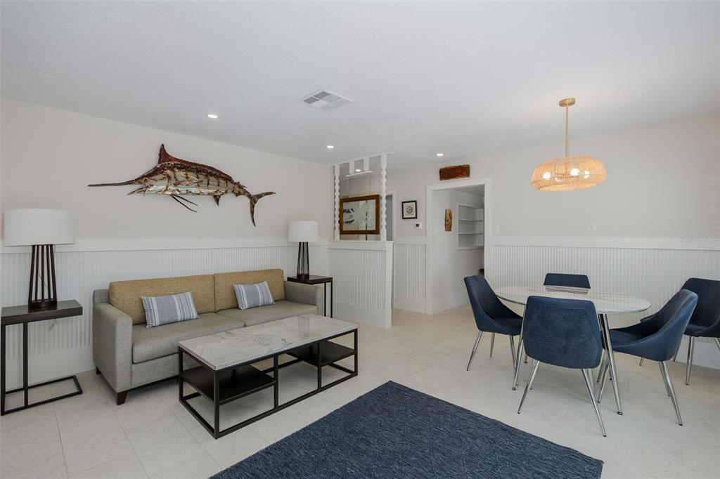 14616 Blessing Lane Hudson, FL 34667 - Photo 7 of 29 a living room with furniture and a lamp