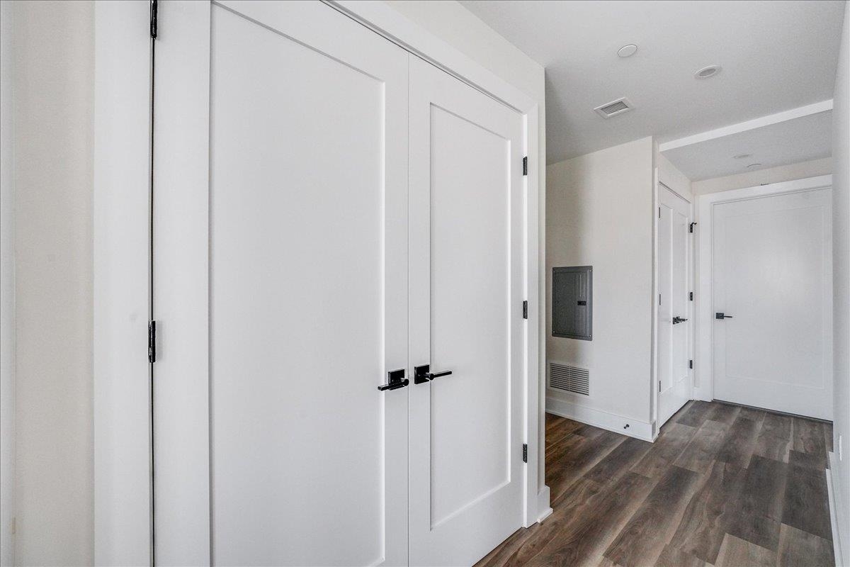 237 Washington Street, Unit 402 Hoboken, NJ 07030 - Photo 16 of 36 a view of a hallway with wooden floor and tub