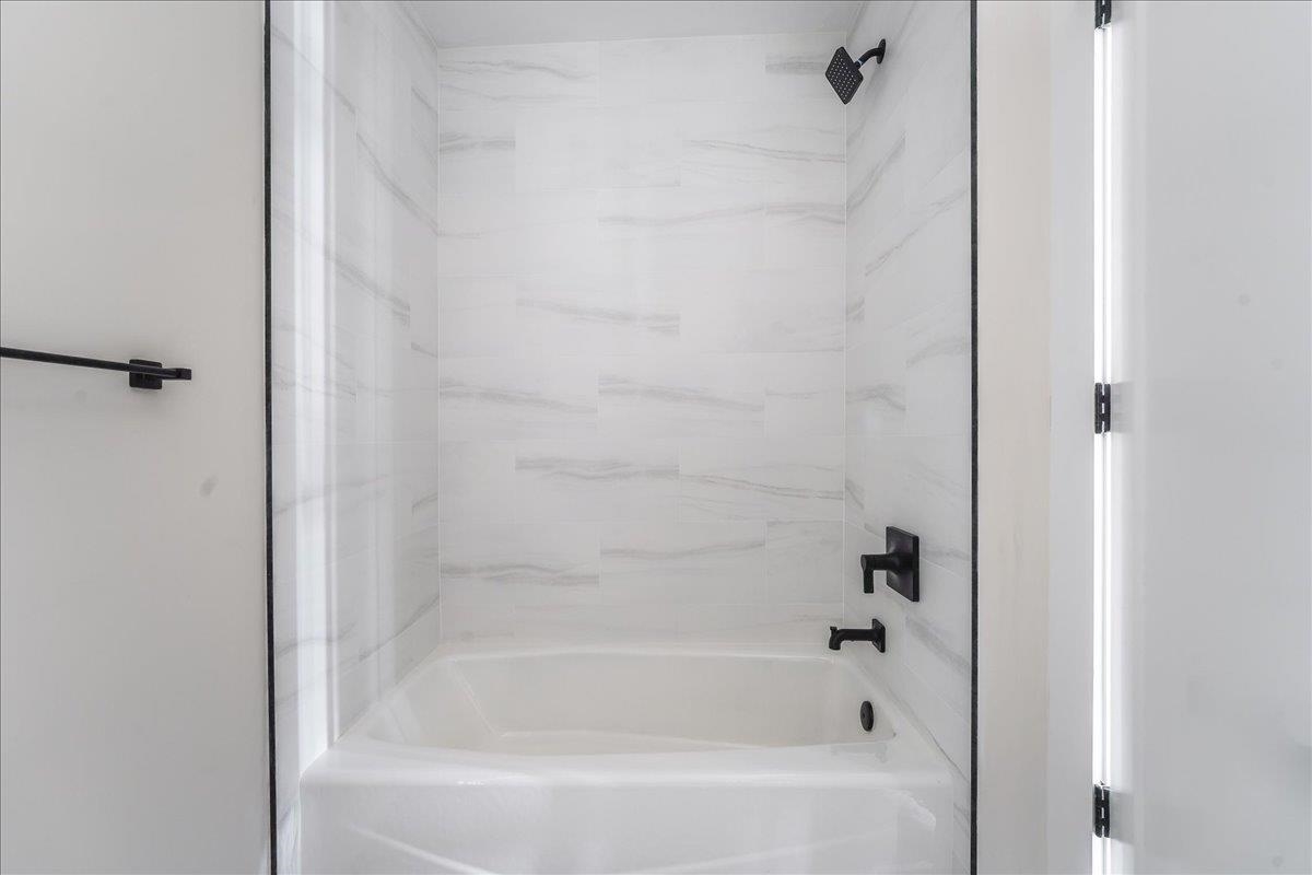 237 Washington Street, Unit 402 Hoboken, NJ 07030 - Photo 17 of 36 a bathroom with a bathtub