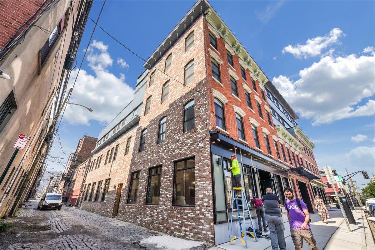 237 Washington Street, Unit 402 Hoboken, NJ 07030 - Photo 23 of 36 a view of a building with a street