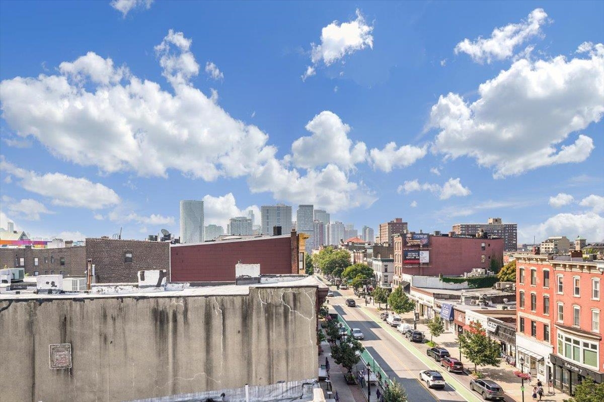 237 Washington Street, Unit 402 Hoboken, NJ 07030 - Photo 33 of 36 a view of a city with tall buildings