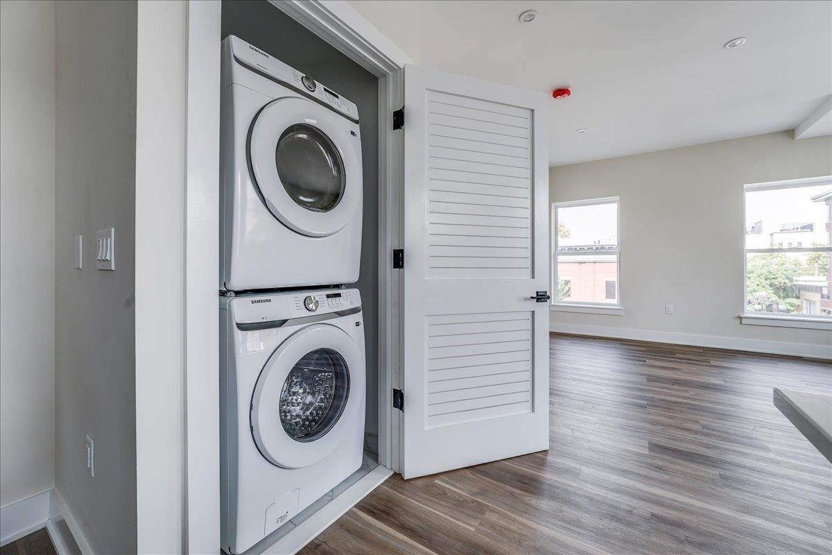 237 Washington Street, Unit 402 Hoboken, NJ 07030 - Photo 5 of 36 a view of a hallway with washer and dryer