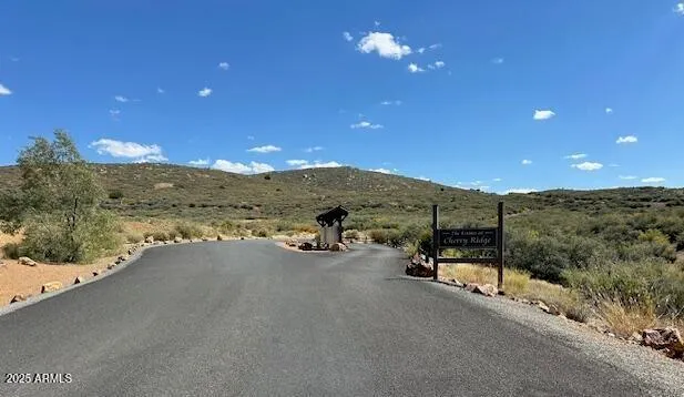 a view of a mountain range in a cloudy sky