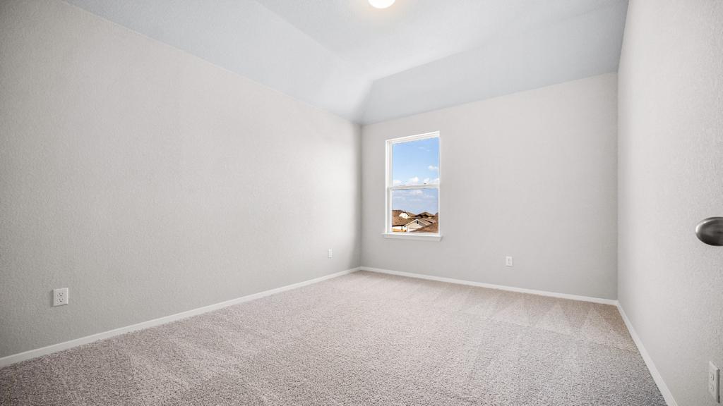 208 Stein Road Georgetown, TX 78626 - Photo 21 of 30 Carpeted empty room with baseboards and vaulted ceiling