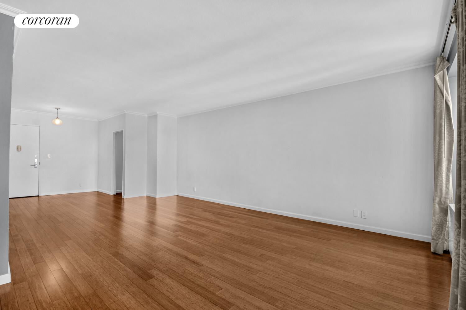 205 3rd Avenue, Unit 12A Manhattan, NY 10003 - Photo 4 of 11 a view of an empty room with wooden floor