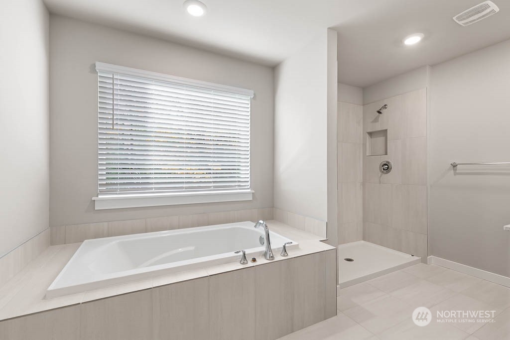 4403 228th Place South East, Unit 14 Bothell, WA 98021 - Photo 18 of 22 a bathroom with a bathtub and shower