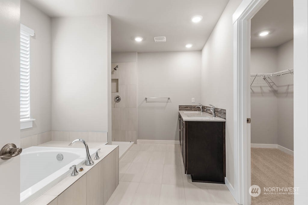 4403 228th Place South East, Unit 14 Bothell, WA 98021 - Photo 22 of 22 a spacious bathroom with a bathtub and a sink
