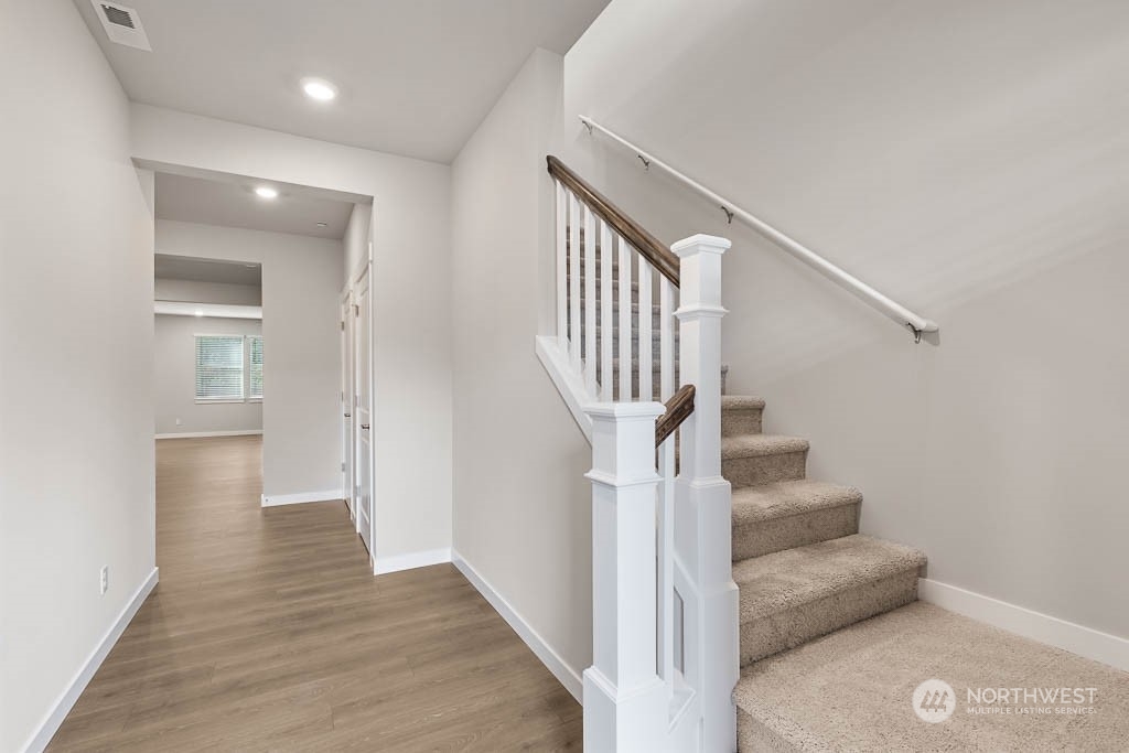 4403 228th Place South East, Unit 14 Bothell, WA 98021 - Photo 3 of 22 a view of entryway and hall with wooden floor