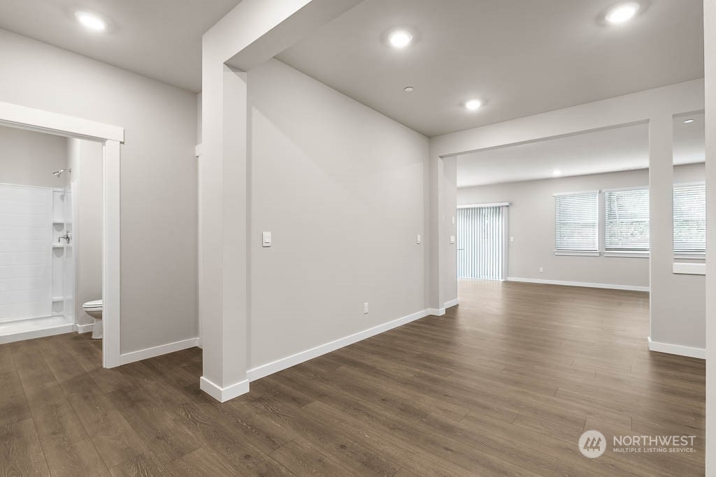4403 228th Place South East, Unit 14 Bothell, WA 98021 - Photo 5 of 22 an empty room with wooden floor and windows