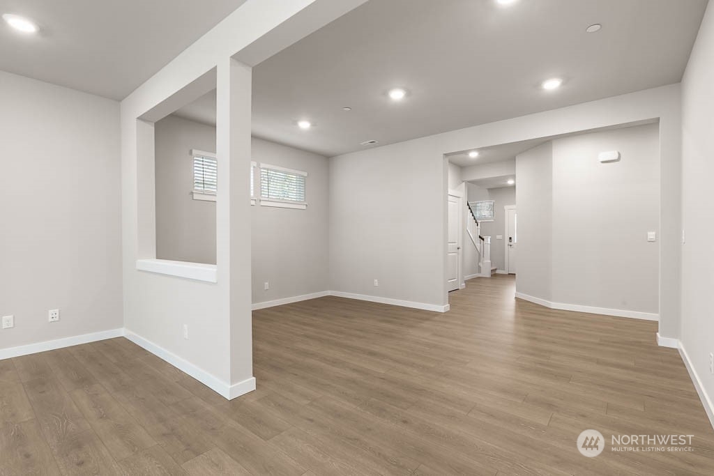 4403 228th Place South East, Unit 14 Bothell, WA 98021 - Photo 6 of 22 a view of an empty room with wooden floor