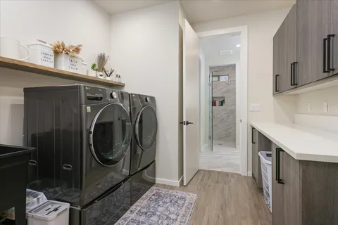 a bathroom with a washing machine and a sink