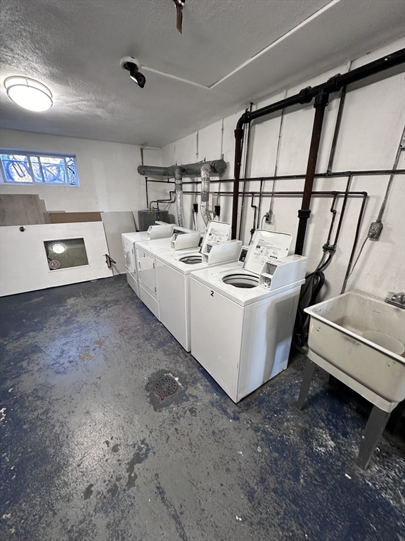 20 Hy-Sil Avenue, Unit 7 Chelsea, MA 02151 - Photo 8 of 9 a utility room with dryer and washer