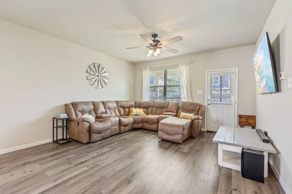 a living room with furniture and a large window